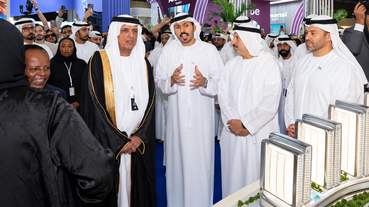 Binghatti exhibition with attendees viewing architectural models